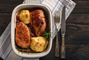 Roasted duck breast with apples and cranberries.