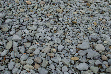 Background photograph of some stones of a Menorca beach.