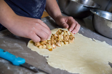 Preparing apple and cinnamon strudel 