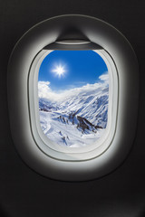 Fototapeta na wymiar Mountains Alps at Austria in airplane window