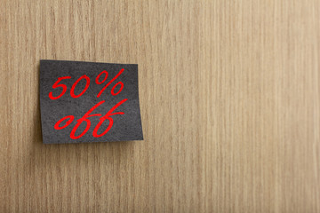 Post it and marketing message of black friday sale on wall.
