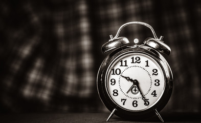 Retro alarm clock. Image in black and white color style