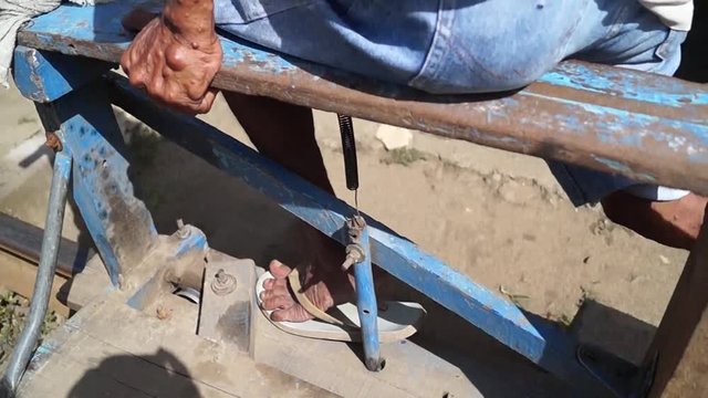 railroad trolley operator drives foot driven passenger cart