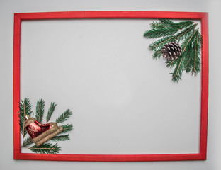 Christmas concept, Christmas tree twigs and Christmas tree cones on a white background, frame, place for text