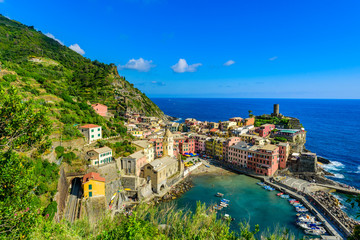 Obraz premium Vernazza - Village of Cinque Terre National Park at Coast of Italy. Beautiful colors at sunset. Province of La Spezia, Liguria, in the north of Italy - Travel destination and attractions in Europe.