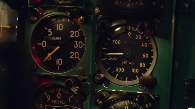 Close up shot of working vertical speed indicator and altimeter on instrument panel on airplane
