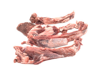 Raw ribs with meat on a white background