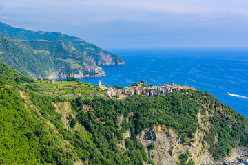 Naklejka na ściany i meble Corniglia - Village of Cinque Terre National Park at Coast of Italy. In the background you can see Manarola. Province of La Spezia, Liguria, in the north of Italy - Travel destination in Europe.