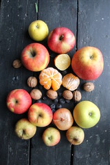 fruits, onions and nuts lie on an old vintage table