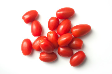 closeup of mini organic tomatoes roma on white background - obrazy, fototapety, plakaty
