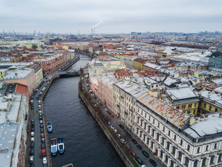 Autumn cloudy day with view of rooftops; different architecture style houses, mansions with...
