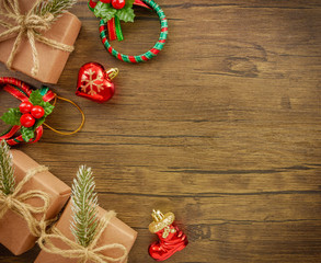 Flat lay,top view Christmas ornaments and Christmas gifts on wooden background with copy space