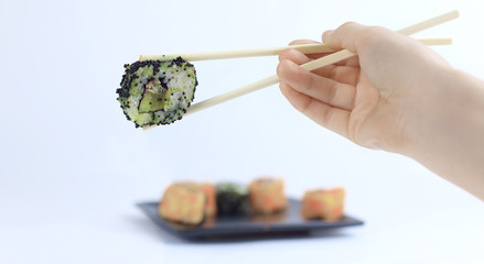 Sushi rolls with white sticks. Japanese cuisine.