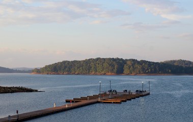 A view of the fishing pier at the lake in the early morning.