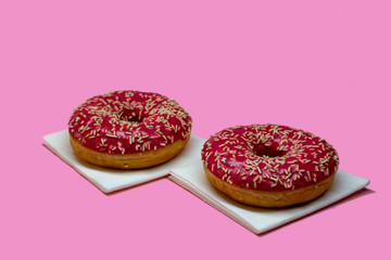 Pink-glazed doughnuts.