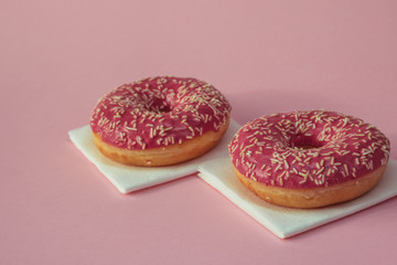Pink-glazed doughnuts.