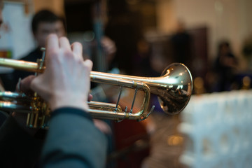 Obraz na płótnie Canvas Saxophone closeup at the event. Musical instrument playing jazz