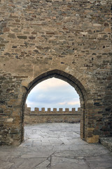 Fototapeta na wymiar arch in the stone wall of the castle