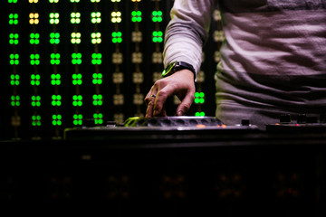 Deejay at the Party.hand of the DJ operator.DJ playing music at mixer closeup