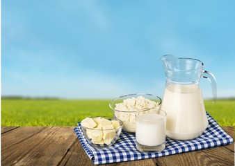 Glass of milk and bottle on  background