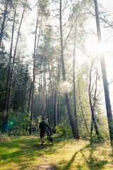 Fototapeta premium Man and his bike in the forest