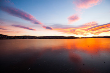 beautiful sunset at the frozen lake - 232974669
