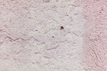Old wall painted with pink paint as a background