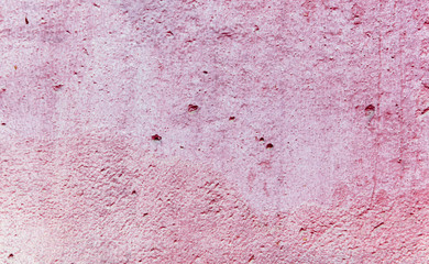 Old wall painted with pink paint as a background