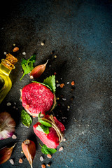 Raw beef fillet steaks mignon with spices and herbs 