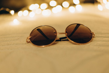 round sunglasses isolated on white blanket