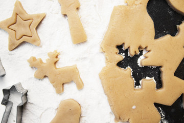 christmas gingerbread cookies with cutter , dough and rolling pin, full frame