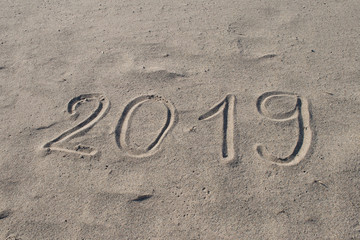 2019 hand drawn on the sand. New Year is Coming or Holidays Catalog Abstract Background Design