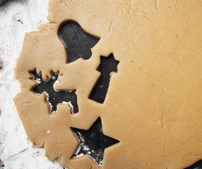 christmas gingerbread cookies with cutter , dough and rolling pin, full frame