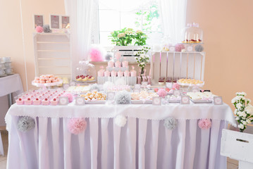 Lovely pastel pink candy bar at the wedding party