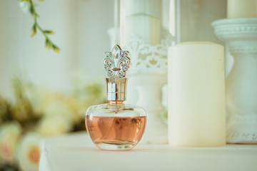 Beautiful perfume bottle Aroma of women's perfume. Caramel colored