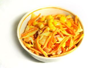 salad of sweet corn, carrots and chicken. on a white background