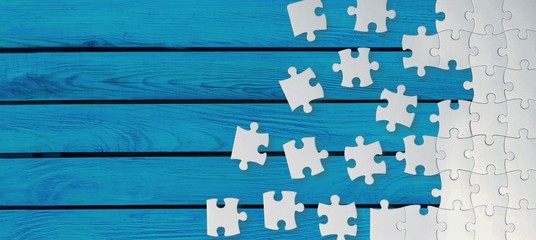 White puzzle pieces on blue background