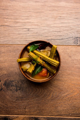 Drumstick Curry or Shevga sheng bhaji or south indian Sambar, served in a bowl over moody background. Selective focus