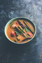 Drumstick Curry or Shevga sheng bhaji or south indian Sambar, served in a bowl over moody...