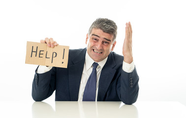 Mature businessman worried and desperate asking for help