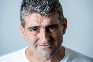 Obraz premium Sad and desperate mature handsome man feeling depressed in Facial expressions and depression