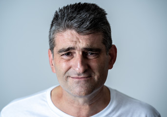 Fototapeta premium Sad and desperate mature handsome man feeling depressed in Facial expressions and depression