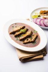 Patodi Rassa Bhaji or patwadi Sabji, a popular Maharashtrian spicy recipe served with Chapati and salad. Selective focus