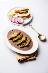 Patodi Rassa Bhaji or patwadi Sabji, a popular Maharashtrian spicy recipe served with Chapati and salad. Selective focus
