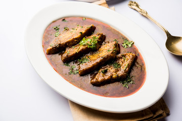 Patodi Rassa Bhaji or patwadi Sabji, a popular Maharashtrian spicy recipe served with Chapati and salad. Selective focus