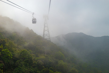 cable railway in foggy mountains