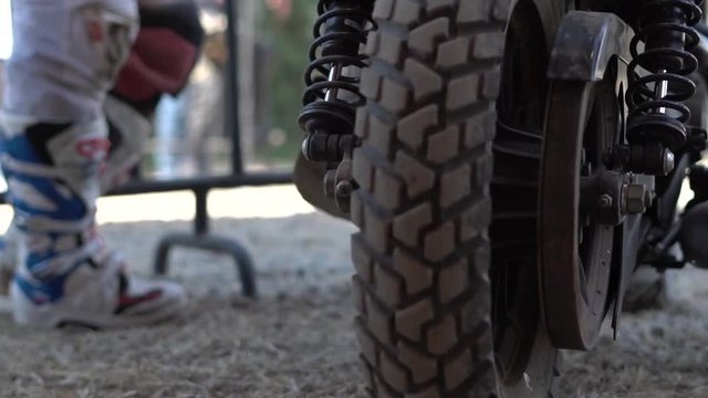 race bike tire on dirt road in slow motion 120fps