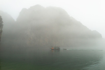 boat on the lake with foggy weather