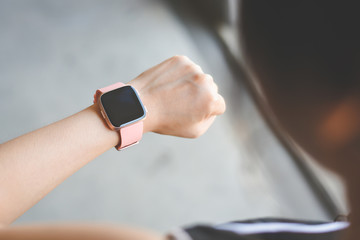 Woman checking smartwatch