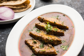 Patodi Rassa Bhaji or patwadi Sabji, a popular Maharashtrian spicy recipe served with Chapati and salad. Selective focus